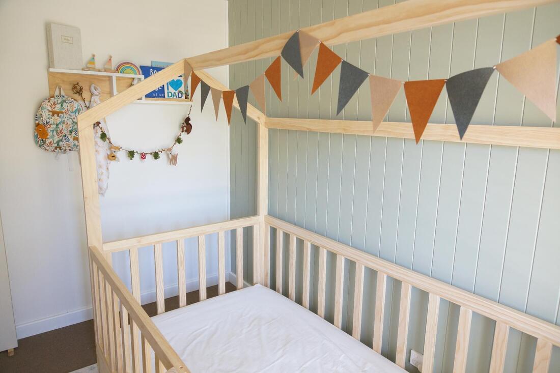 Picture of house bed with rails and no horizontal bar