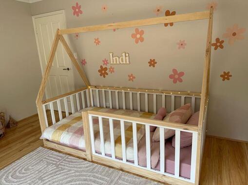 Picture of canopy bed on the floor with white rails